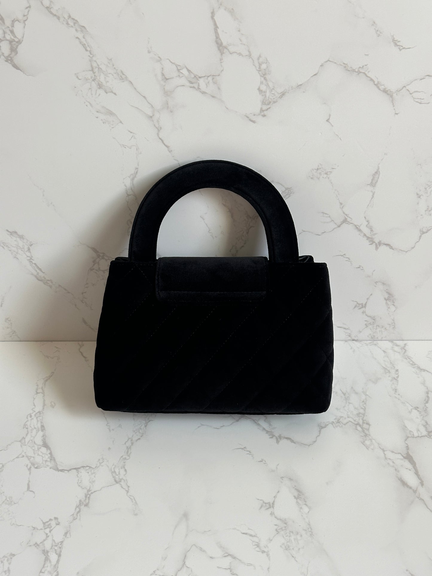 Chanel Vintage Top Handle Bag, velvet suede with a quilted pattern and gold-tone hardware.