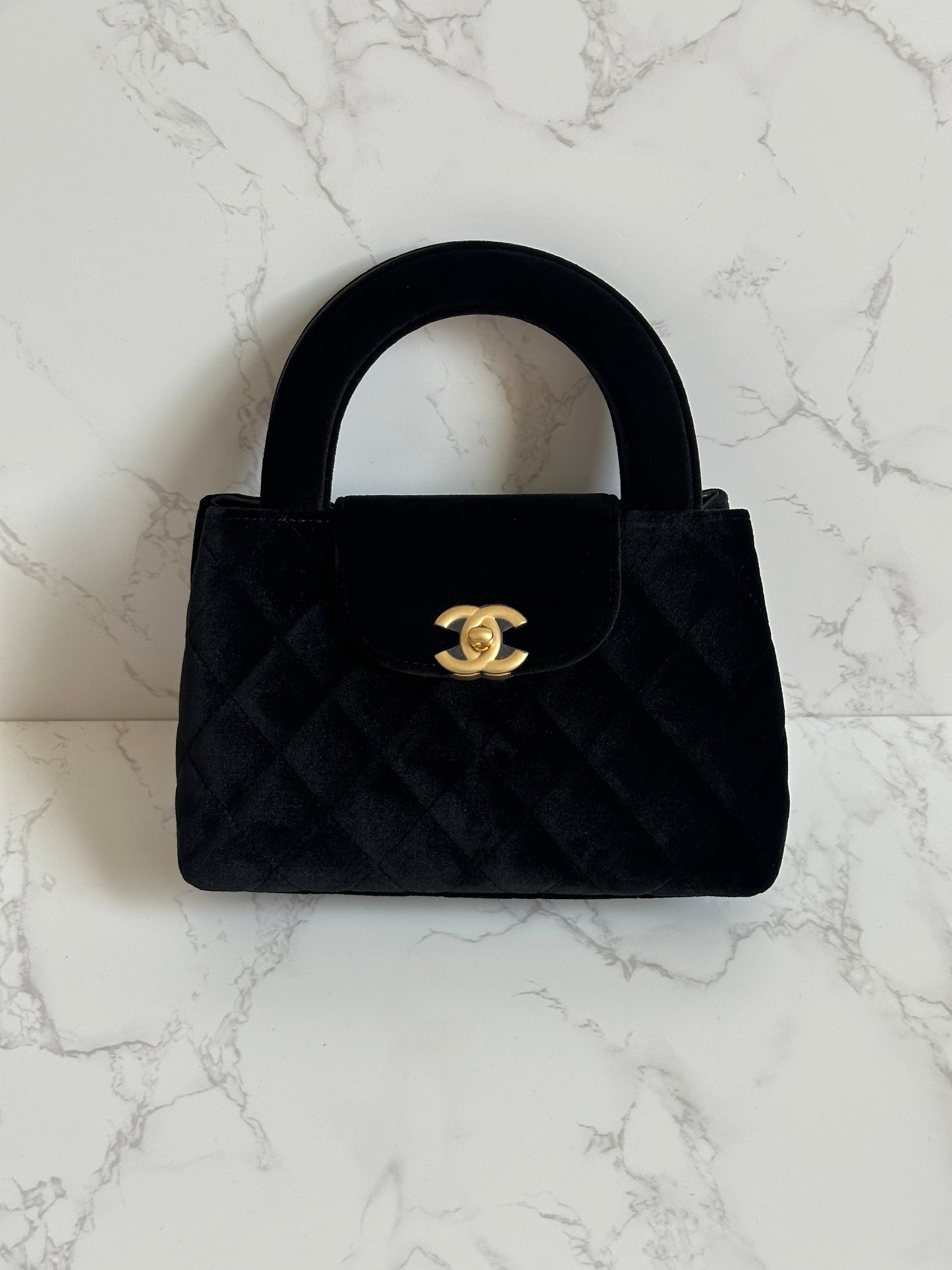 Chanel Vintage Top Handle Bag, velvet suede with a quilted pattern and gold-tone hardware.
